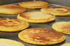 Arepas de choclo doradas en la plancha
